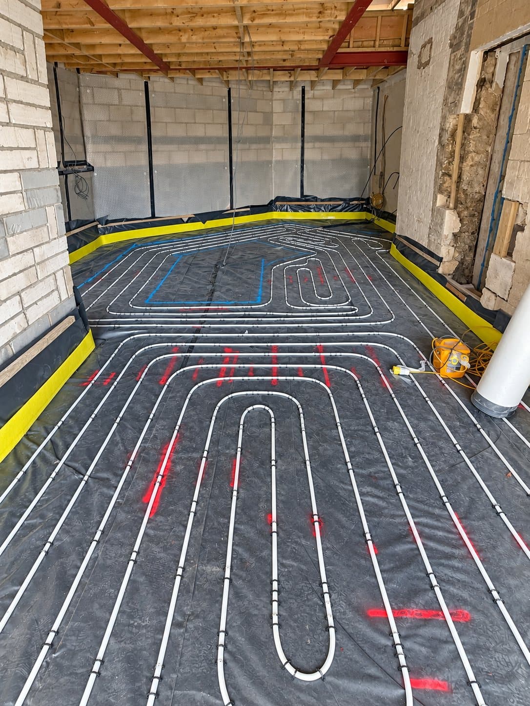 Underfloor heating pipework laid out in an extension before the screed