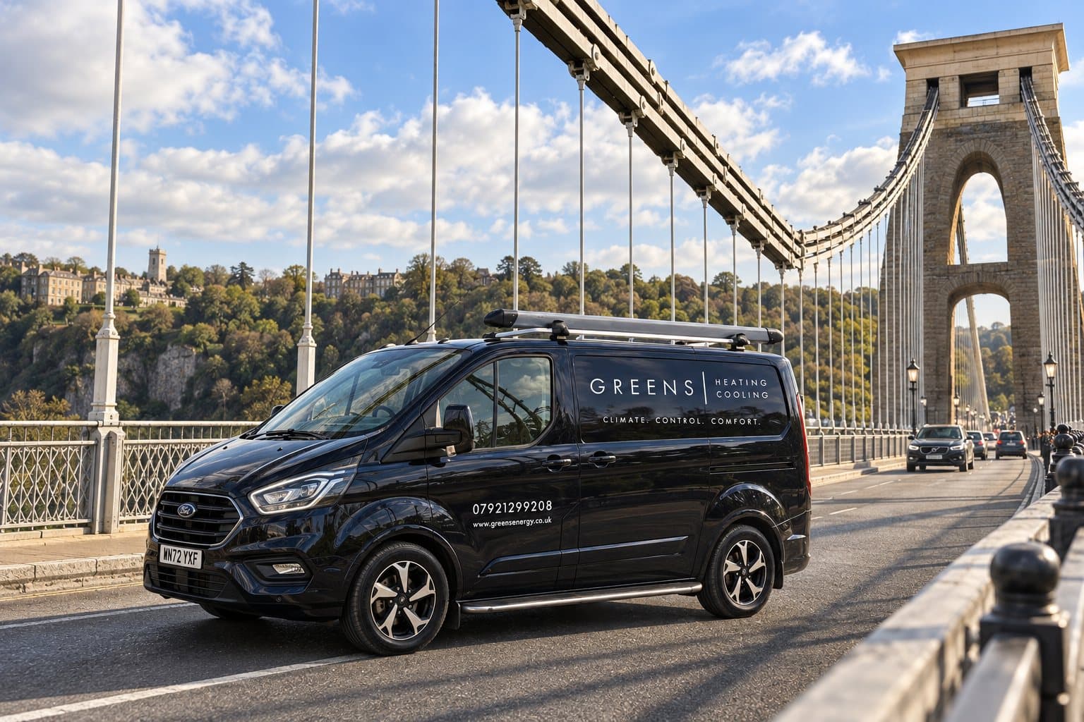 A Greens Heating & Cooling van crossing the Clifton Suspension Bridge